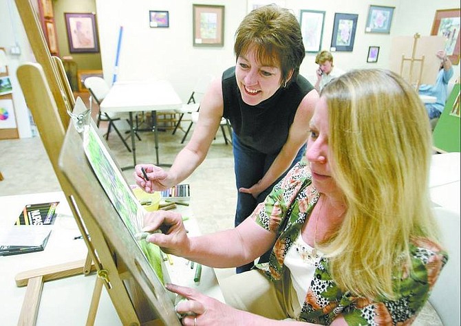 Cathleen Allison/Nevada Appeal Arlene Origoni talks with pastel painting student Teri Sweeney at the Artistic Viewpoints Gallery &amp; Studio on Thursday afternoon in Gardnerville.