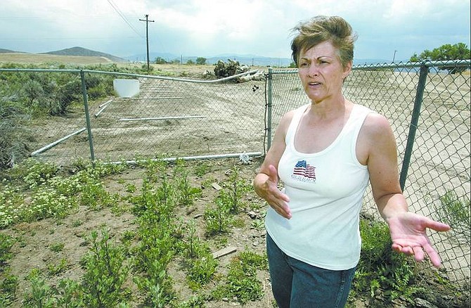 Cathleen Allison/Nevada Appeal Tammy Lubich talks Tuesday about the ongoing problem with property damage allegedly caused by the freeway construction.