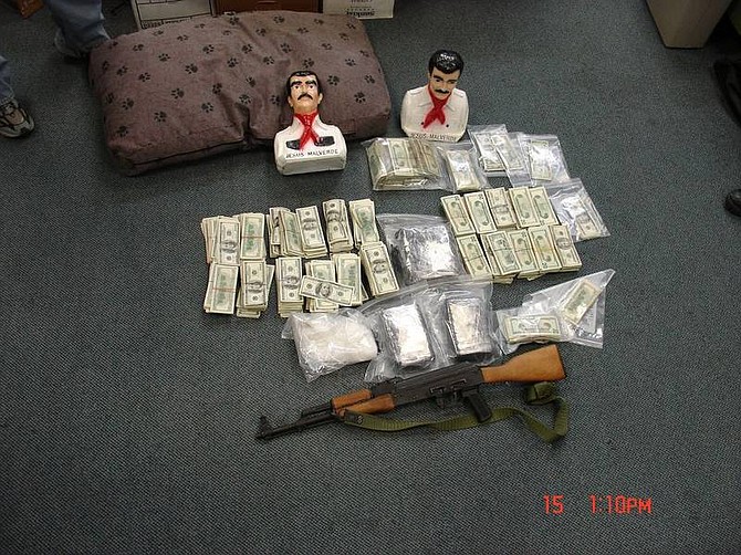 Photo courtesy of Tri-Net Drug officers seized nearly a half million dollars in drugs and cash from three homes in Dayton and Carson City during raids early Thursday morning. Also seized were two handguns and an AK-47. The busts are of Jesus Malvedere, Mexico&#039;s Robin-Hood like hero from the late 19th century once known as the &quot;Generous Bandit,&quot; but now best known as: &quot;The Narco Saint,&quot; the patron saint of drug smugglers.