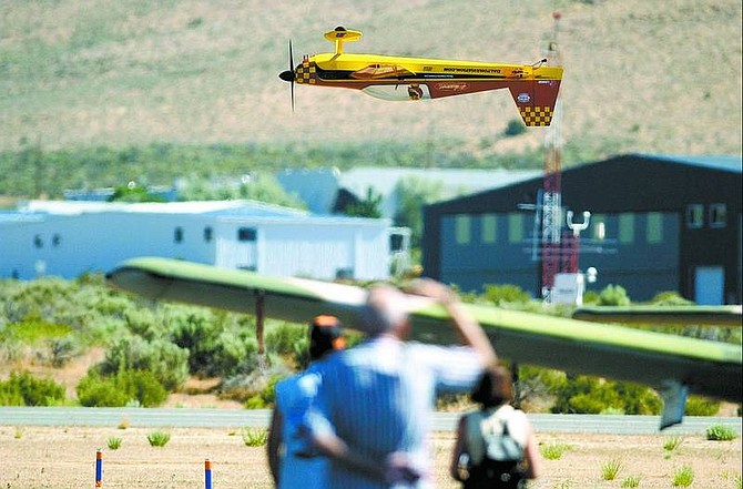 Brad Horn/Nevada Appeal Mark Leseberg operates miniature plane, a 40-percent scale Extra 300, during a demonstration at the Carson City Airport&#039;s open house on Saturday.
