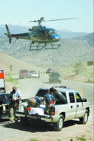 Cathleen Allison/Nevada Appeal  A 33-year-old Carson City man was injured in a single-vehicle rollover on Highway 341 near the junction of Highway 342 on Thursday afternoon.