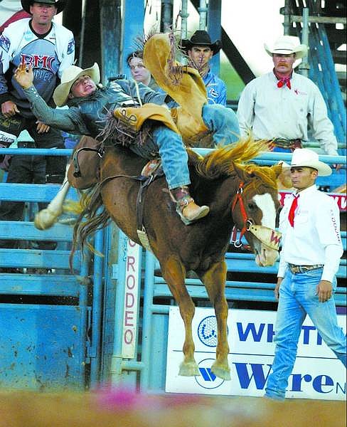 BRAD HORN/Nevada Appeal Shane Anderson, of Spring Creek, competes in the bareback bronc riding competition at the Reno Rodeo on Wednesday. Anderson grew up on a ranch in Orvada and began competing in rodeo in high school.