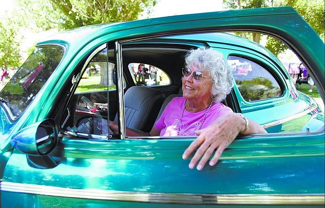 Chad Lundquist/Nevada Appeal Dona Gomes of Stockton, Calif., sits in her car at the Run What Cha Brung Car Show on Sunday at Fuji Park. Gomes&#039; 1941 Chevy Deluxe Coupe was selected from over 300 entries as the People&#039;s Choice Award winner.