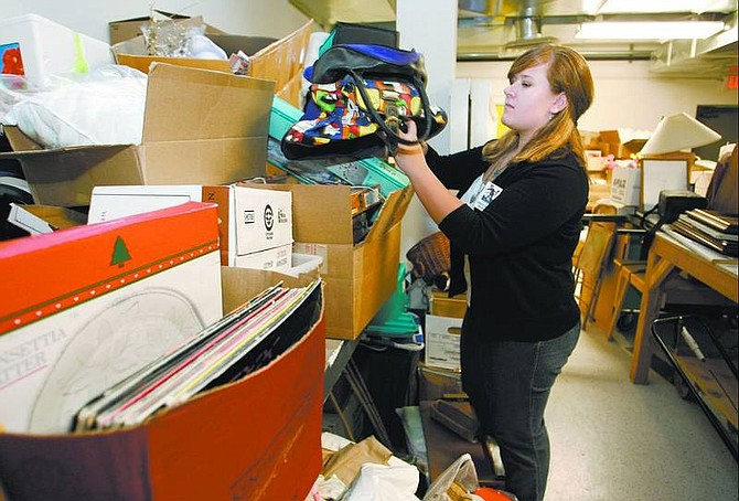 Cathleen Allison/Nevada Appeal Candice Chilton, office manager for the Children&#039;s Museum of Northern Nevada, sorts through donated items Thursday. The museum is collecting items for their &quot;Really Big Sale&quot; fundraiser to be held July 8.