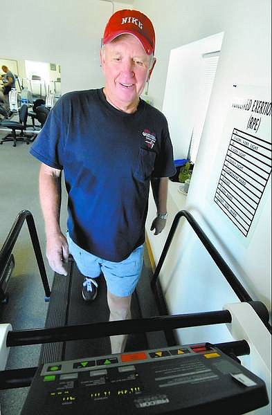 Kevin Clifford/Nevada Appeal Bruce Glover, 59, exercises Friday morning at the Carson Tahoe Cardiac Rehabilitation Services center at the Carson Mall. Glover recently had a quadruple-bypass surgery and exercises at the center to keep his heart healthy.