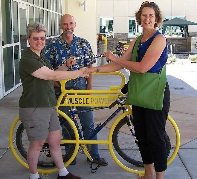 From left, Dr. Colleen Lyons, Chas Macquarie and Anne Macquarie at the bike rack installation ceremony.