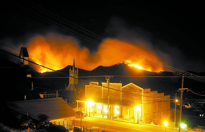 BRAD HORN/Nevada Appeal File Photo C Street in Virginia City is illuminated by the Six Mile 2 fire early in the morning of July 24. The demands of today&#039;s information-now culture are changing how news about wildfires spreads, prompting firefighting agencies to post updates on the Internet.