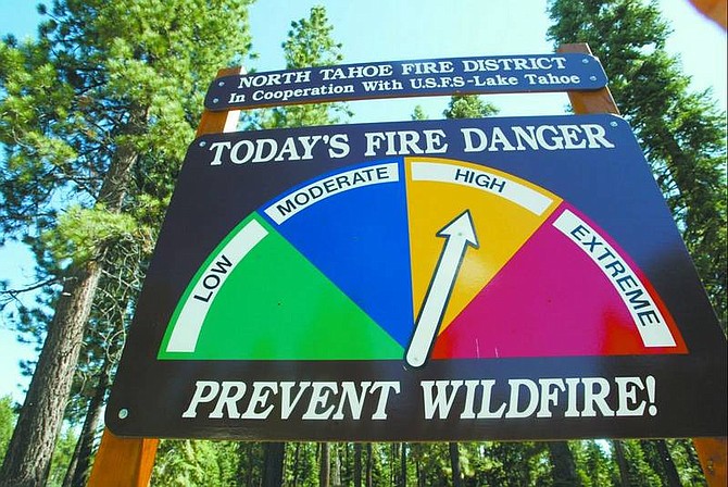 Ryan Salm/Sierra Sun Monitoring stations are placed throughout the Sierra Nevada. Measurements from these and various scientific methods are used to predict fire threat locally. This process is reflected on signs such as the one shown here.
