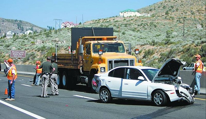 Chad Lundquist/Nevada Appeal A Reno man was injured Wednesday morning when the car he was driving collided with a Nevada Department of Transportation truck in the southbound lanes of Highway 395. The crash occurred about 2,000 feet south of Lakeview Road.