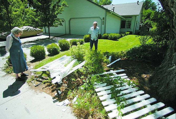 BRAD HORN/Nevada Appeal John and Barbara Silberman woke up to knocks by a Carson City sheriff&#039;s deputy at around 10 Tuesday night, and found a car on its side and their front yard fence and mailbox destroyed.