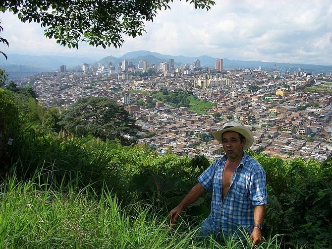 Sean Lehmann/For the Appeal A roadside worker in the coffee country pauses above the city of Pereira.