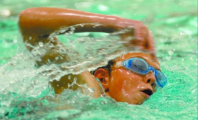 Kevin Clifford/Nevada Appeal Lucas Johnson, 12, swims Saturday afternoon during the first part of the Capital City Kids Triathlon at the Carson City Aquatic Center and Mills Park. The 11-12 age group swam 200 meters before biking 2.6 miles and running .8 miles.