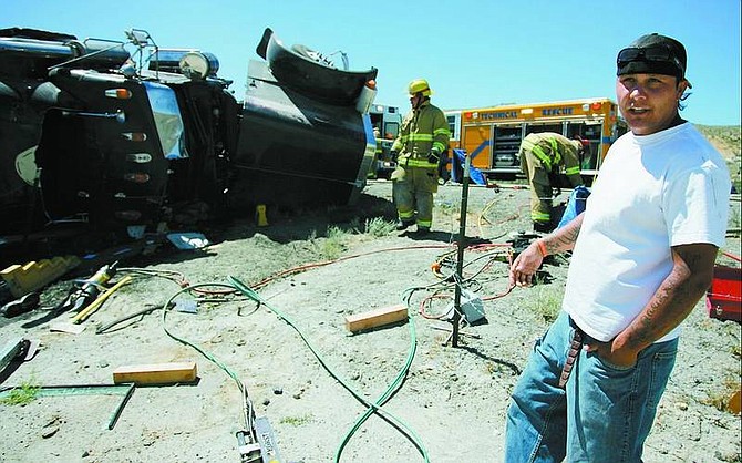 Chris Sargent, of Carson City, explains how he put out a tractor trailer fire with his feet on Thursday afternoon.