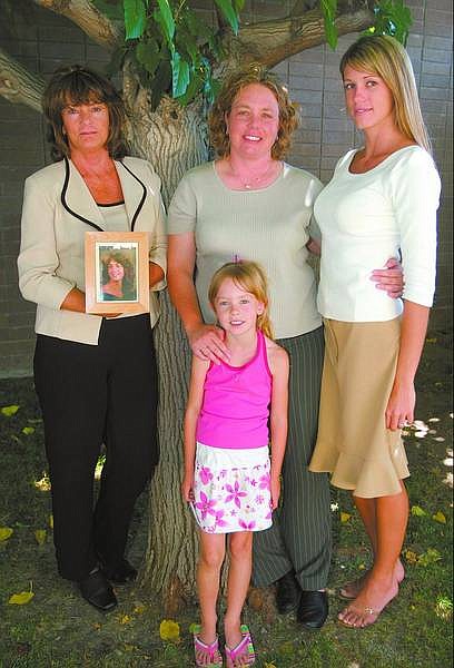 SARAH KING/Appeal News SErvice Linda Bratton, left, holds a picture of her murdered daughter Sheila Harris. Center, Shannon Harris and her daughter, Madison Duncan, 6, and Jamie Bratton, 25. Shannon Harris was 7 and Jamie Bratton 6 months old when their sister Sheila was killed in 1982.
