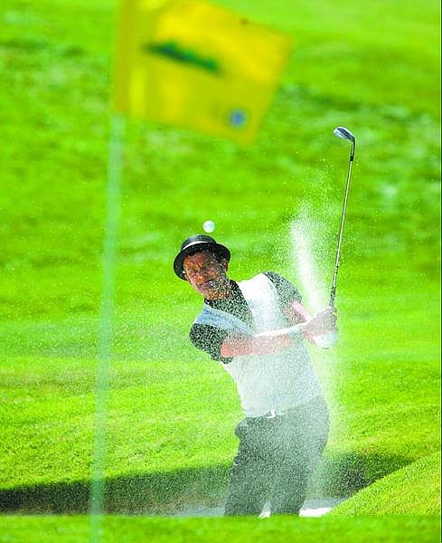 Jesper Parnevik, of Stockholm, Sweden, hits out the bunker and onto the 9th green during the opening round of the Reno-Tahoe Open at Montreux Golf &amp; Country Club in Reno, Nev., on Thursday, Aug. 24, 2006. (AP Photo Brad Horn)