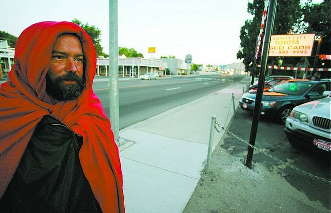 BRAD HORN/Nevada Appeal Phillip walks down Carson Street just after 6 a.m. asking for change. Phillip said that he wasn&#039;t homeless but claimed to have slept on a bench the night before.