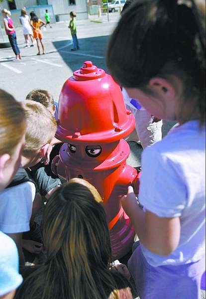 Chad Lundquist/Nevada Appeal Pluggie The Fireplug robot was the center of attention during a surprise visit to the Carson City Boys &amp; Girls Club on June 26.