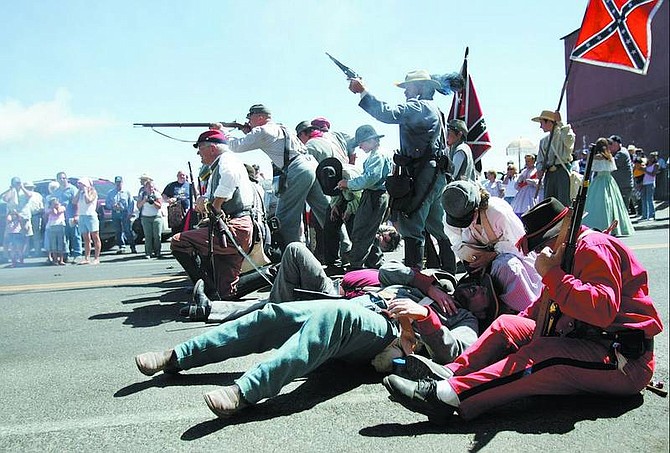 Chad Lundquist/Nevada Appeal Comstock Civil War Reenactors take aim during a battle that took place on C Street directly after the Virginia City Labor Day Parade on Monday.