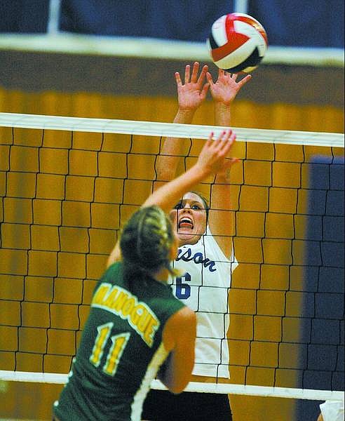 BRAD HORN/Nevada Appeal Carson&#039;s Danae Eckart attempts a block in the Senator&#039;s game against Manogue at Morse Burley Gym in Carson City on Thursday.