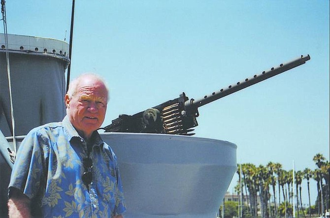 Dave T. Henley/For the Appeal Capt. Bud Tretter is photographed with one of the P-520&#039;s 50-caliber machine gun turrets. The machine guns on the restored p-520 are exact replicas.
