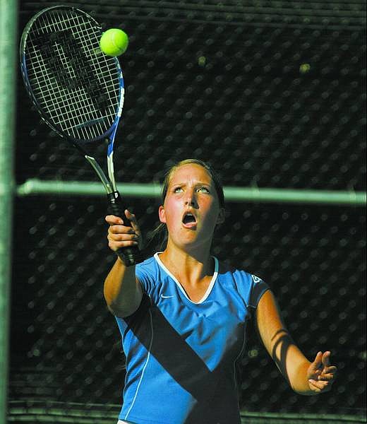 BRAD HORN/Nevada Appeal Carson senior Sarah Asp, 17, returns a serve during her doubles match against Douglas High School on Thursday.