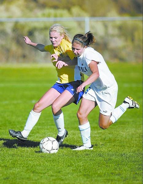 Cathleen Allison/Nevada Appeal  Wildcat&#039;s Coutney Lenhart fights against Salt Lake Community College defender Mandy Jensen during Friday afternoon&#039;s game at Edmonds Sports Complex. WNCC won 3-2.