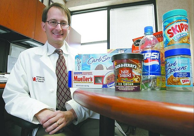 Mark Humphrey/Associated Press Dr. Russell Rothman, of Vanderbilt University Medical Center in Nashville, Tenn., displays some of the products he used in his study of nutrition labels and how well people understand them on Sept. 25. According to Rothman&#039;s findings, a common problem when checking nutrition labels is a failure to factor in serving size. Even when people do, they often miscalculate how much they&#039;re eating.