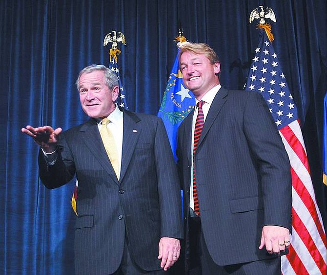 Pablo Martinez Monsivais/Associated Press President Bush, left, is introduced by Republican candidate for Congress, Nevada Sec. of State Dean Heller, right, during a fundraiser reception, Monday, in Reno.