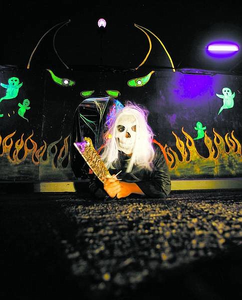 BRAD HORN/Nevada Appeal Joesph Lopez, 15, has assisted Rafael Adrian with his haunted house at 1137 Lindsay Lane.