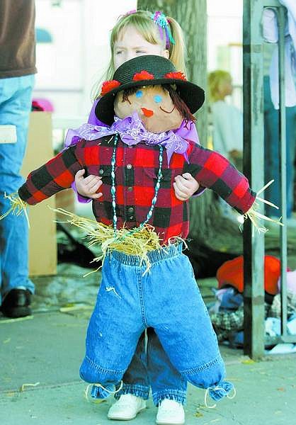 BRAD HORN/Nevada Appeal Rebecca Linn, 4, of Carson City, holds her finished scarecrow she named Rebecca at the Children&#039;s Museum of Northern Nevada on Saturday morning.