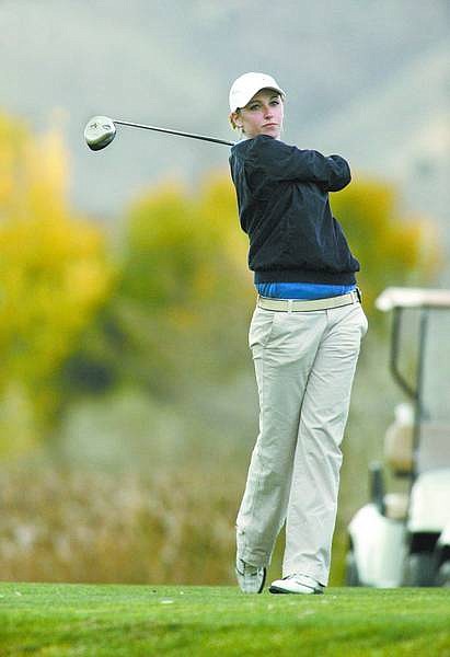 Cathleen Allison/Nevada Appeal  Lydia Peri watches her shot off the second tee Tuesday at Empire Ranch Golf Course during the NIAA state girls championahip.