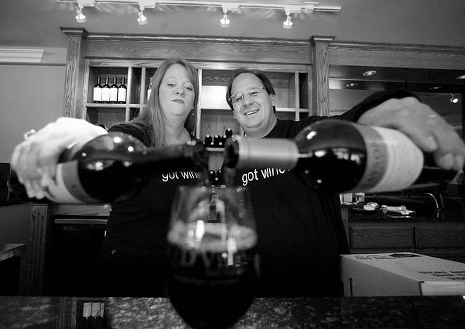 BRAD HORN/Nevada Appeal Chris and Kim Donner prepare to open their wine bar today for Nevada Day.