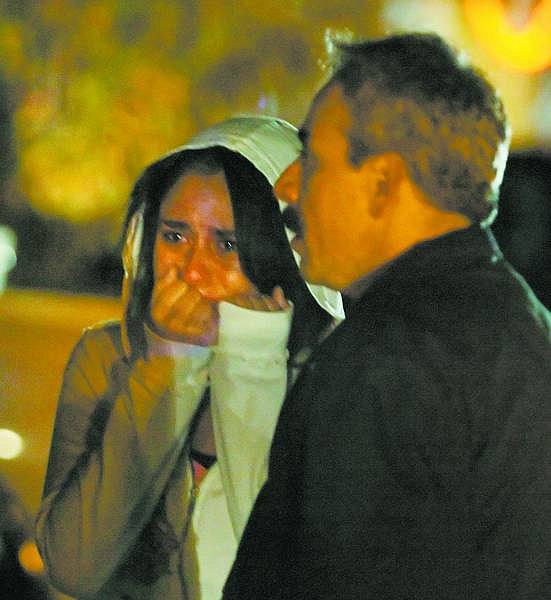 BRAD HORN/Nevada Appeal A girl reacts while her father picks her up on Longridge Drive in Carson City after a shooting at a Halloween party on Friday evening.