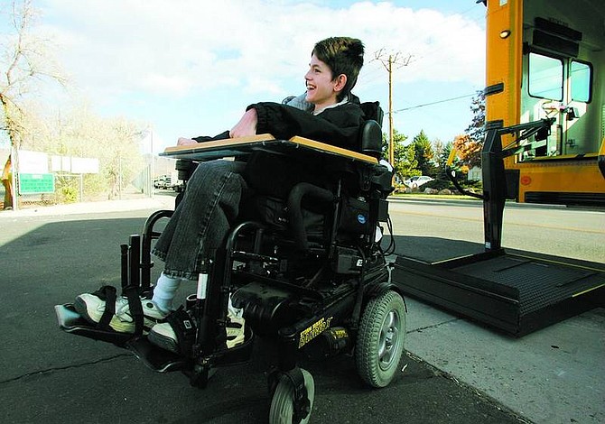 BRAD HORN/Nevada Appeal Jared Dempsey gets off a Carson City School District bus on Koontz Lane on Wednesday.