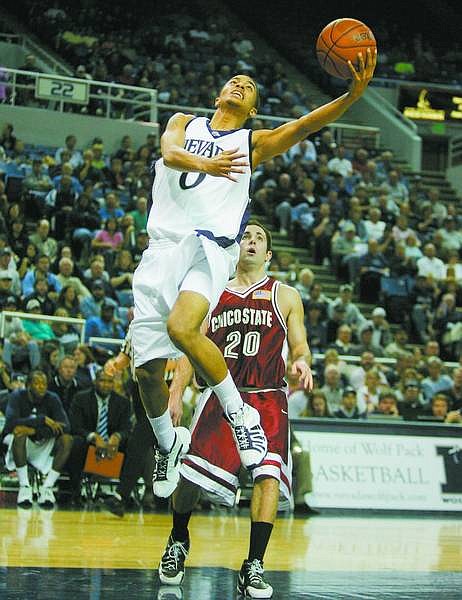 Nevada Wolf Pack guard Brandon Fields drives past Chico State guard Jon Baird during the first half of a college basketball game in Reno, Nev., on Tuesday, Nov. 7, 2006, at Lawlor Events Center. (AP Photo Brad Horn, Nevada Appeal)