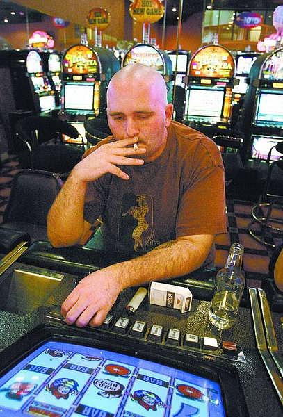 Cathleen Allison/Nevada Appeal Jon York, of Carson City, smokes at the Pi&#241;on Plaza Casino Resort on Tuesday afternoon.