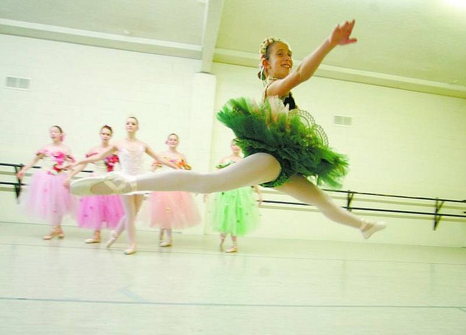 BRAD HORN/Nevada Appeal Cara Dopf, 12, of Carson City, gets airborne as she rehearses her part as the marzipan candy-dancer soloist for &quot;The Nutcracker&quot; at Pinkerton Dance Studio on Saturday morning.