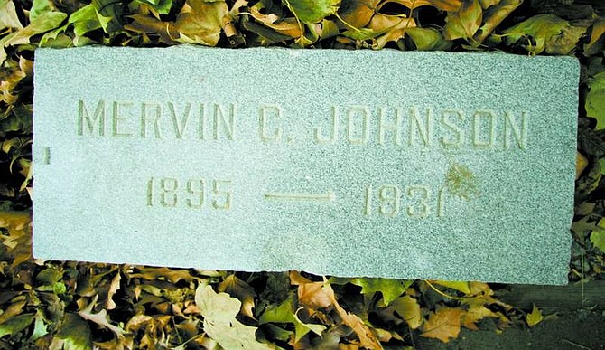 Photos by Brad Horn/Nevada Appeal The tombstone of former Dayton resident Mervin Johnson was found two years ago buried under the asphalt at the corner of El Rancho Drive and Prater Way in Sparks. It is made of polished granite, and is 8 inches thick, 2 feet long and 12 inches high.