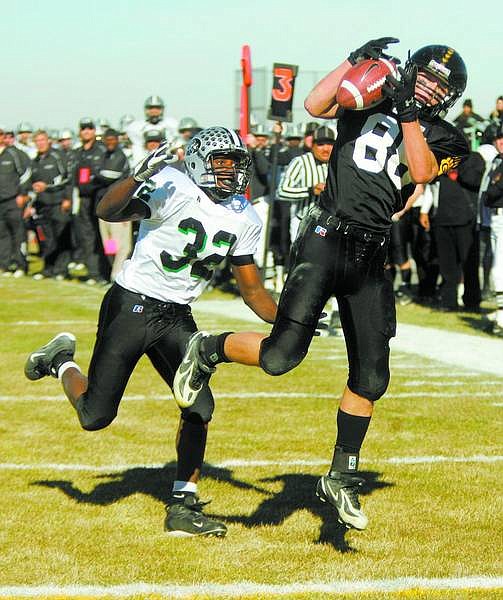 BRAD HORN/Nevada Appeal Galena&#039;s Jason Parkinson catches a touchdown pass during the first half in their semi-final Nevada state playoff game against Palo Verde at Galena on Saturday. The Grizzlies won 35-0.
