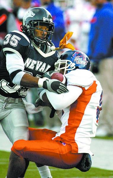 Nevada defender Paul Pratt gets called for pass interference against Boise State&#039;s Jeremy Childs during the fourth quarter of Saturday&#039;s football game, Nov. 25, 2006 in Reno, Nev. Boise State won 38-7. (AP Photo/Cathleen Allison)