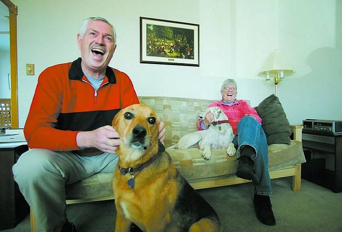 BRAD HORN/Nevada Appeal Pat Stanley and his sister Martha Stanley sit with the family dogs Brier, left, and Patch, at Stanley&#039;s home on Saturday. Stanley, who was adopted, met his birth family three years ago that includes nine brothers and sisters.