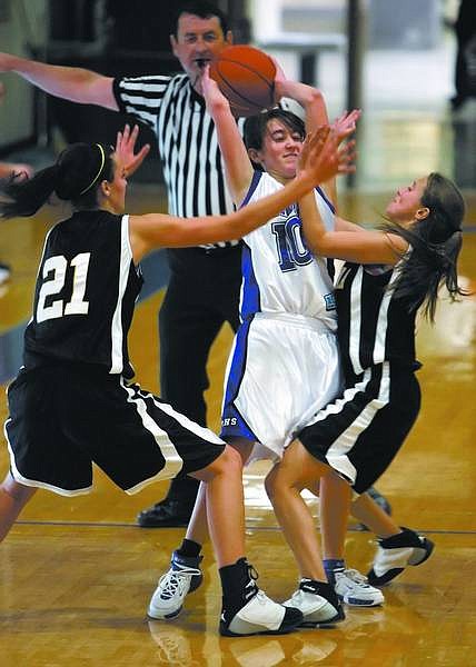 Chad Lundquist/Nevada Appeal  Carson&#039;s Megan Kilty gets fouled by Galena&#039;s Colleen Mullins, right, during Tuesday&#039;s game.