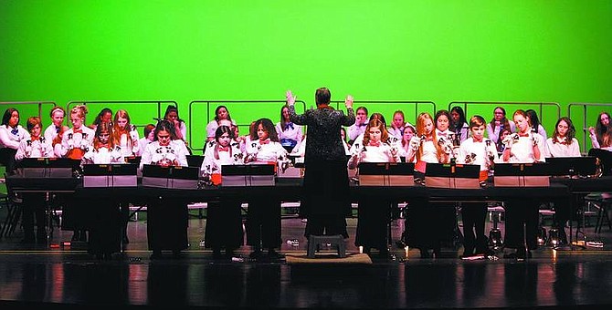 Chad Lundquist/Nevada Appeal Director Nancy Mielke leads students from Carson Middle School during Tuesday&#039;s annual winter concert at the Carson City Community Center. Students from the beginning sixth, seventh and eighth grades Red Hot Bell Pepper&#039;s choir dedicated the performance to friends and family serving in the United States Military.