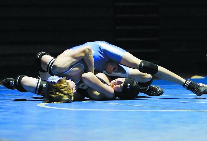 Chad Lundquist/Nevada Appeal Carson High&#039;s Nick Schlager works to pin North Valleys Andrew Mazzoni during Wednesday&#039;s Match.