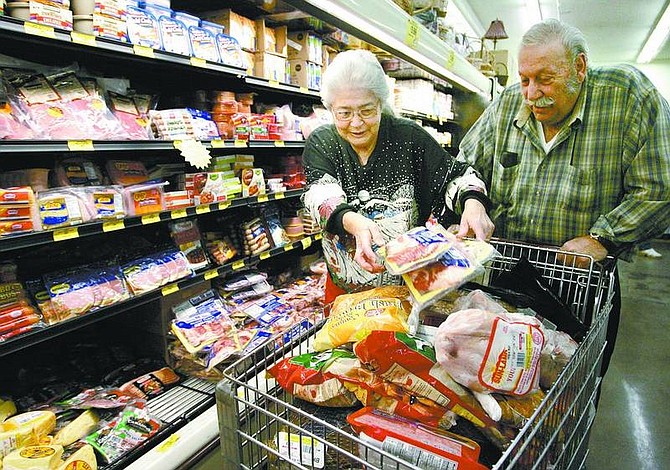 Cathleen Allison/Nevada Appeal Maxine and Ron Fortino shop at Grocery Outlet on Friday afternoon. A free two-minute shopping spree netted the couple more than $330 worth of groceries.