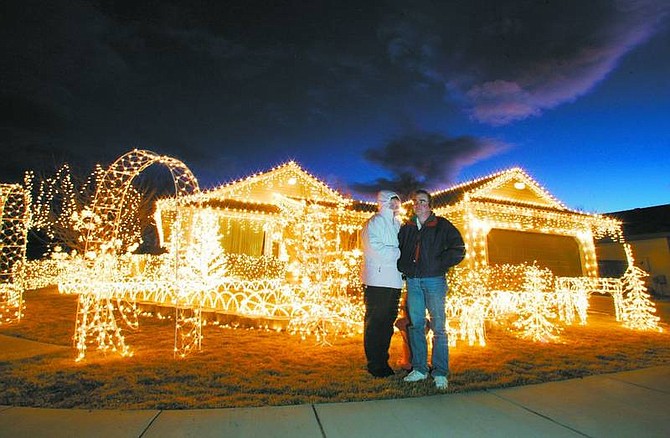 BRAD HORN/Nevada Appeal Dale and Ruth Defilippi, winners of the Nevada Appeal&#039;s annual Christmas lights contest, stand in front of their creation on Quinn Drive on Wednesday.