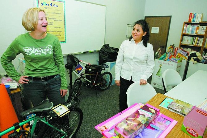 BRAD HORN/Nevada Appeal Valerie Perkins, left, and Miriam Silis, talk about this year&#039;s Toys for Tots program at the Ron Wood Family Resource Center on Thursday. The program in Carson City provided more than 8,000 toys for about 500 area families at Christmas.