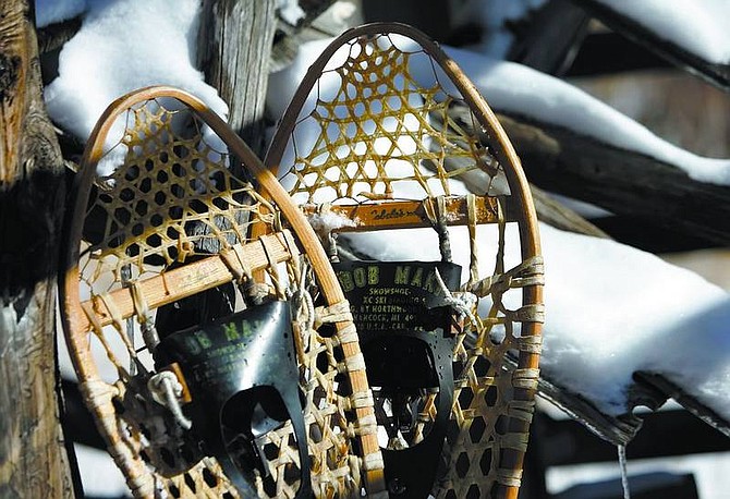 Chad Lundquist/Nevada Appeal Traditional ash-and-gut snowshoes may look unwieldy - but try negotiating deep, fluffy powder in short, narrow aluminum shoes.