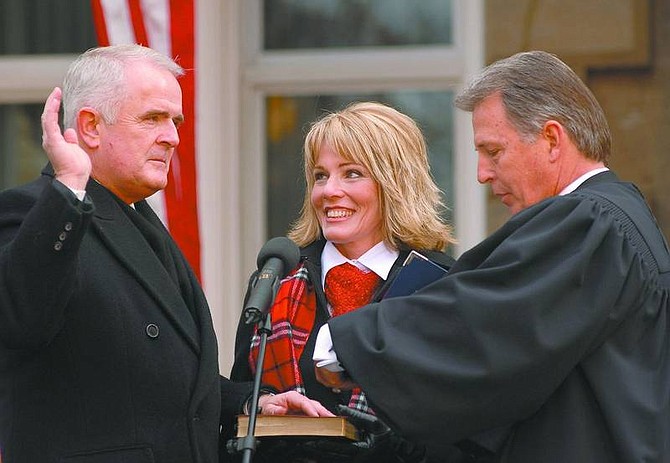 Kevin Clifford/Nevada Appeal file photo Jim Gibbons takes the Governor&#039;s Oath of Office before Nevada Supreme Court Chief Justice William Maupin on Jan. 2 during his Inauguration. Gibbons recently reflected on his first year as the state&#039;s 29th governor.