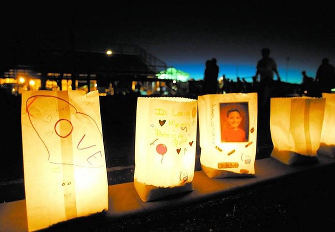 BRAD HORN/Nevada AppealA luminary for Joey Cusumano, an 11-year-old Carson City martial arts student who was diagnosed with Hodgkin&#039;s disease earlier this year, glows while walkers circle the track at Carson High School during the Relay for Life fundraiser on Saturday night.